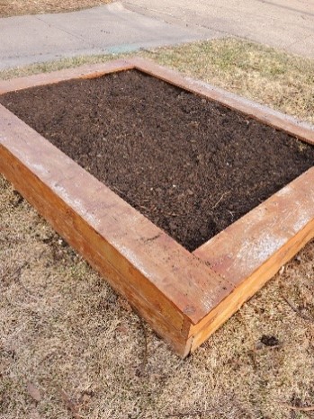 A wooden raised garden bed.